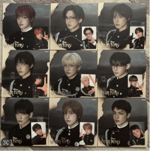 Nine boxed posters of male K-pop idols in black outfits arranged in a 3x3 grid, each with a small inset photo and 'We on Fire' logo.