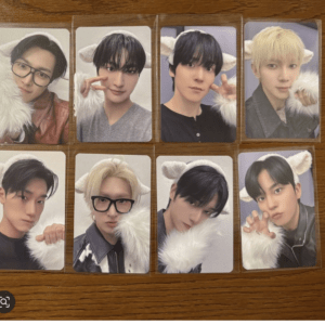 Collage of eight selfies of young men wearing fluffy white ears on a wood surface.