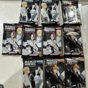 Assorted Bleach Wafers snack packets laid out on a light tile floor.