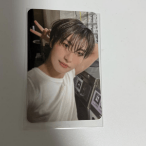 Young person with wet hair taking a selfie, making a peace sign with their fingers