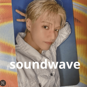 Album cover-style portrait of a person with short blonde hair lying on a blue mat, with the word 'soundwave' across the image.