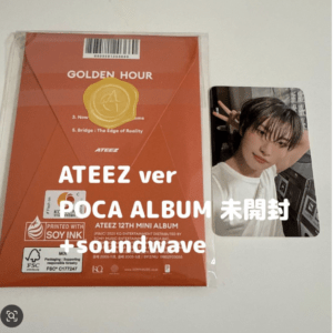 Orange ATEEZ POCA Album cover with a gold seal and white text, plus a photo card of a member making a peace sign on the right the card shows a selfie-style image.