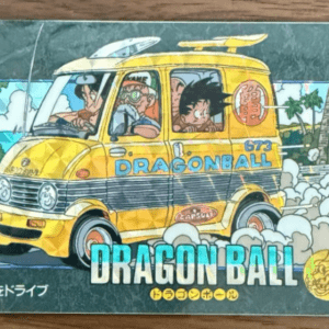 Colorful Dragon Ball bus card: a yellow van labeled 'DRAGON BALL' with three characters visible in the windows, driving through a dusty, smoky road.