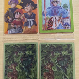 Photo of four Dragon Ball trading cards: top-left is Dragon Ball GT with Goku and friends on an orange background; top-right is Dragon Ball Z card featuring a blue-robed warrior holding a staff; bottom row shows two green jungle-themed backs labeled Dragon Ball GT.  Articulos Japan (Post Box Japan)