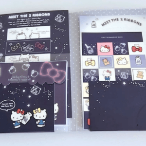 Hello Kitty-themed stationery and booklets displayed on a starry navy background with space ribbons illustrations.