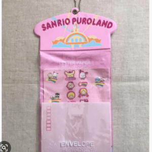 Pink Sanrio Puroland letter paper envelope pocket with a window showing small character stickers (cute characters on a pink folder)