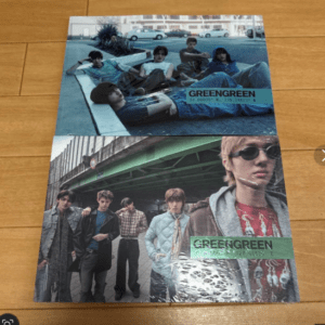 Two GreenGreen promo photos: top image shows five young men relaxing on a blue couch outdoors; bottom image shows the same group posing under a bridge, one wearing sunglasses.