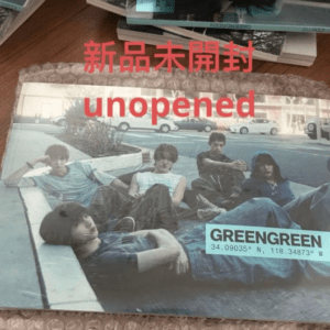 Unopened band album cover by Greengreen, featuring five young men lounging on a street-set photo with red Japanese text.