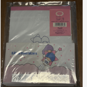 Plastic-wrapped Little Twin Stars stationery set with pink packaging on a wooden surface, featuring cute star characters and the text 'Little Twin Stars' on the front.