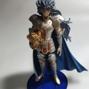 Poseable action figure of a silver-armored warrior with a blue cape, standing on a blue base labeled Virgo, holding a gold helmet in its left hand.