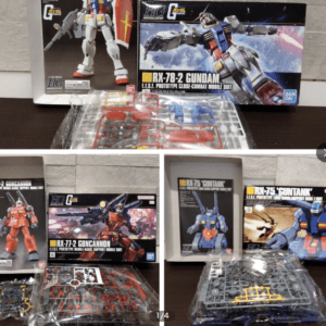 Display of Gundam model kits on a table: RX-78-2 Gundam box in front with other kit boxes and bags of plastic sprues laid out.