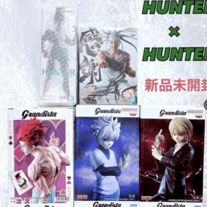 Display of Grandista Hunter x Hunter figure boxes arranged on a shelf, featuring multiple characters in dynamic poses.