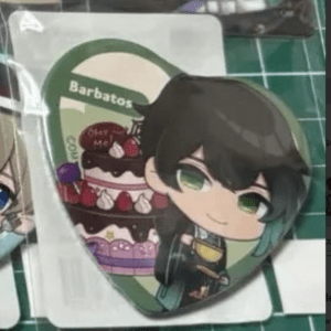 Chibi anime-style character with green eyes beside a layered strawberry cake labeled Barbatos on a green background this appears as a decorative badge.