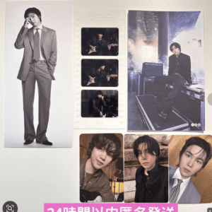 Wall collage of BTS photo posters and a film-strip sleeve with multiple BTS shots, including a person in a suit on the left and concert-stage image on the right, plus three portrait photos at the bottom. A pink banner with Japanese text is at the bottom.