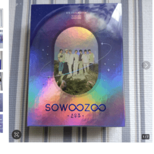 Colorful poster/book cover featuring BTS group photo inside an oval window against a gradient space-like background, with 'SOWOOZOO' text at the bottom.