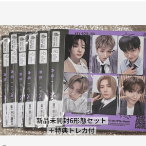 Six sealed photo-card packs featuring individual group member photos, plus a purple binder with six large member portraits; Japanese text advertises a new unopened six-form set with bonus trading cards.
