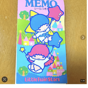 Colorful Little Twin Stars memo pad cover with pink and blue characters in a pastel castle scene and a MEMO title at top.