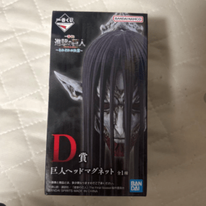 Box packaging for a horror figure: pale, snarling face with long black hair covering the eyes, red 'D' and Japanese text, Bandai Namco logo.