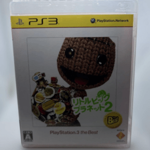PS3 game case for LittleBigPlanet 2 with Sackboy character and colorful stickers, labeled 'PlayStation 3 the Best'.
