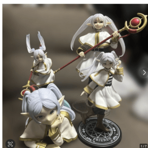 Group of four anime-style elf figurines in white-and-gold outfits, posed with a red staff on a circular base with arcane symbols (collectible display).