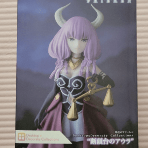 Boxed figure from the Desktop Decorate Collections line, featuring a purple-haired demon girl with horns on a dark purple background. The bottom-left has a pale pink label with the Brand Desktop x Decorate Collections text.
