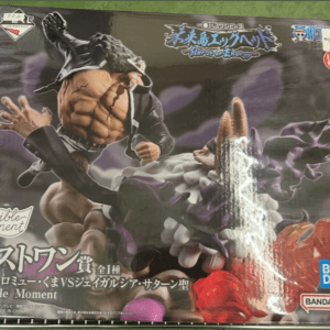 Boxed action figure of a muscular warrior fighting a purple monster, with Revive Moment text visible on the package.