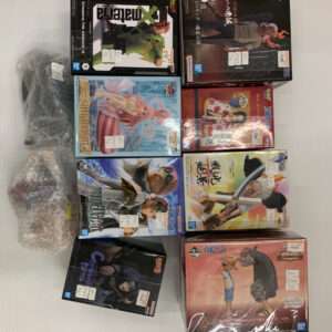 Collection of boxed anime figures laid out on a white surface, some wrapped in plastic, showing various character boxes in different sizes and colors.
