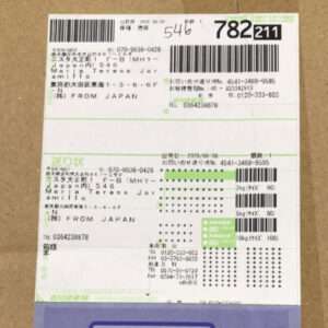 Shipping label on a cardboard box with barcodes, Japanese text, and 'FROM JAPAN'.  Articulos Japan (Post Box Japan)