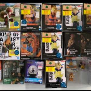 Assortment of boxed anime action figures on a display shelf, featuring various Dragon Ball characters and other collectibles in their packaging.
