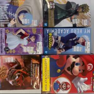 Six boxed anime character figures in colorful packaging on a shelf, featuring characters from popular series like Naruto and Mario.