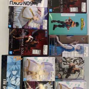 Assortment of Bandai anime figure boxes arranged on a white surface, viewed from above.