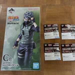 Boxed Naruto MasterLISE figure with a green gradient front, featuring Kakashi-like character and Bandai logo; four smaller packet boxes nearby on the right.