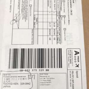 White international shipping label with multiple barcodes and a large barcode, destined for Tochigi-ken, Japan, showing sender in the United Kingdom and a customs/track number.