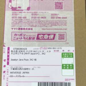 Pink Yamato courier package label showing recipient name Joselyn Jara Pozo, address in Japan, barcode, and tracking numbers; shipping details visible on a white label.