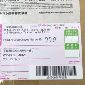 Japanese international shipping label with recipient Paola Andrea Cruces Munoz and a barcode at the bottom, pink and white form.