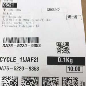 Parcel label: Ground service, date 06/21, time 15:15, to Alexandra Rodriguez, weight 0.1 kg, includes barcode and QR codes.  Articulos Japan (Post Box Japan)