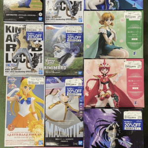 Rows of boxed anime figures on display shelf, featuring various character boxes in colorful artwork and poses, arrayed in a grid pattern.