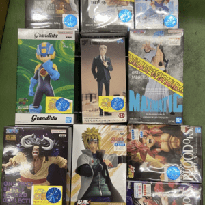 Display of boxed anime action figures on a store rack, with colorful packaging featuring characters like Dragon Ball, One Piece, Naruto, and more; blue sale stickers on several boxes.