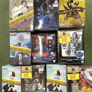 Shelf of boxed anime figurines on display, featuring Naruto and Dragon Ball characters among others.