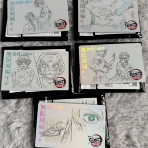 Six manga volumes laid out on a grey surface; covers show illustrated characters with colored title blocks and red seals.