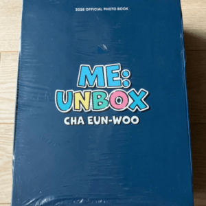 Blue box packaging for 'Me: Unbox Cha Eun-woo' 2025 official photo book on a wooden floor surface.