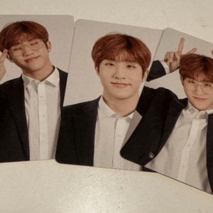 Three photo cards of a young man in a suit posing and making peace signs with both hands.