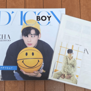 Cover of D'ICON BOY magazine featuring Cha Eun-woo holding a yellow smiley ball; a secondary page with a photo sits beside it.