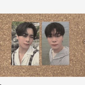 Two vertical photo prints of a young man with dark hair on a corkboard, left outdoors in a white shirt with plaid suspenders, right by water in a gray hoodie.