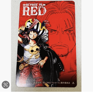 One Piece Film: Red cover art featuring a young pirate in front of a bold red face artwork behind him.