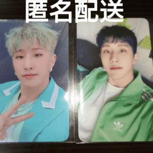 Two photo cards of a young man with pastel teal hair: left card shows him in a turquoise suit flashing a peace sign, right card shows him in a green Adidas jacket.