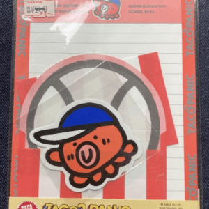 Vintage Taco Panic packaging with a cartoon orange pig wearing a blue cap and red/white striped background.