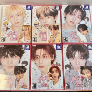 Six boxed K-pop idol merchandise laid out in two rows of three, featuring close-up photos of young male idols on pastel packaging with small character stickers.