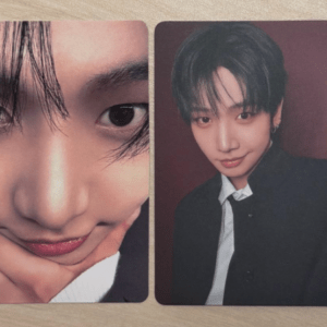 Two photo cards on a wooden surface: left a close-up of a young man with his chin resting on his hand, right a formal portrait in a black blazer.
