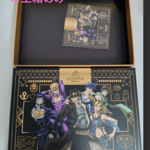 Opened JoJo Godiva 50th Anniversary box with an empty inner tray; pink Japanese text indicates 'empty box only'.